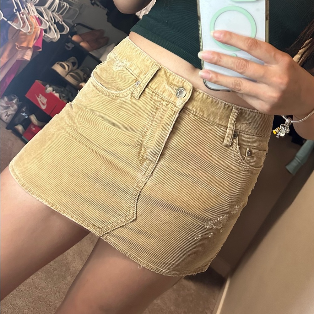 Denim mini skirt, sexy fit, size 4, color beige